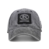Front-facing view of gray cap with FNH Firearms logo patch prominently displayed.
