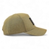 Right side profile of tan cap with perforated panels and FNH Firearms patch on front.